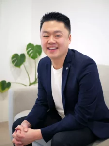 Ray Ong Sitting on Couch Casual Smile